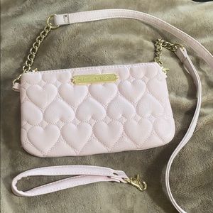 Betsey johnson pink, clutch or a crossover purse.